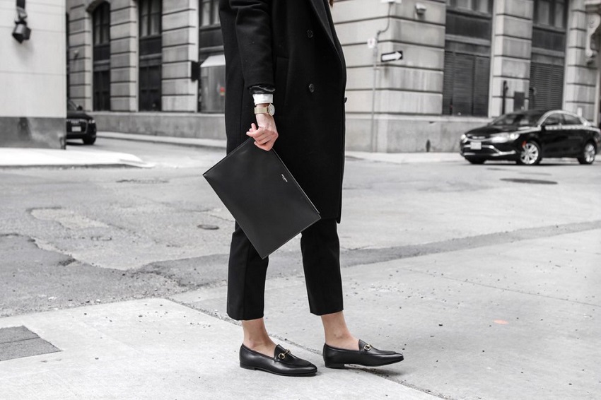 picture of a woman wearing stylish loafers as the timeless shoe style 
