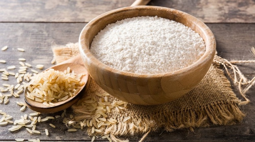 rice all purpose flour in wooden bowl on table