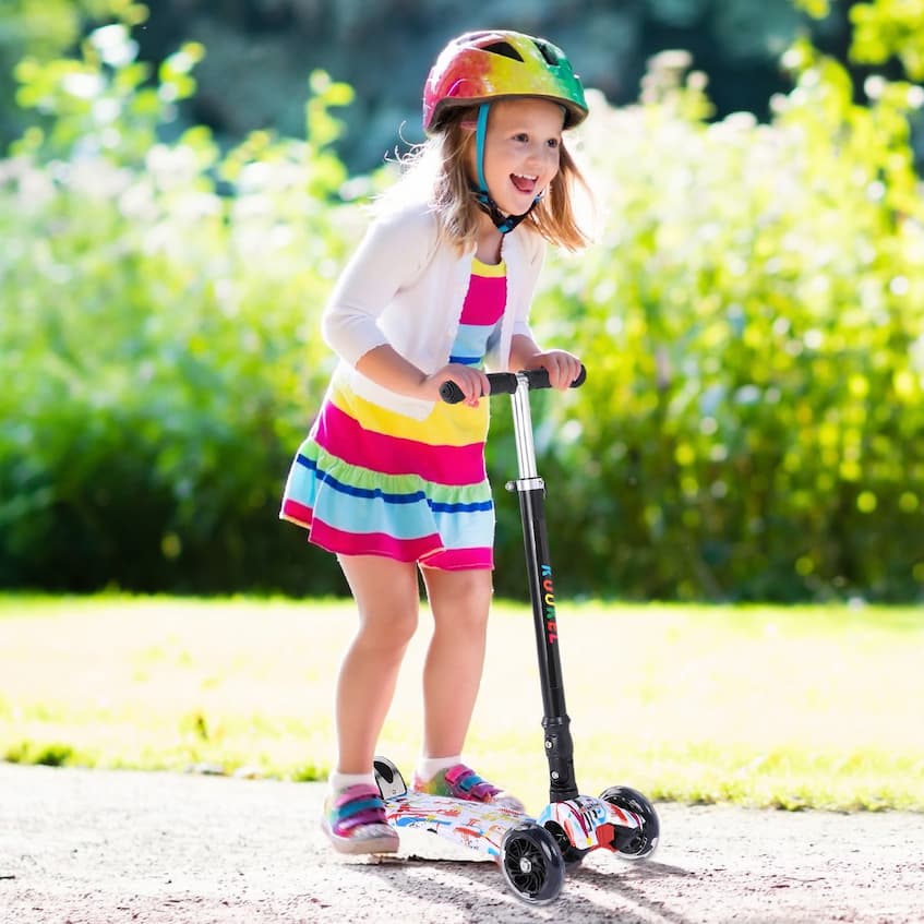 happy toddler on scooter