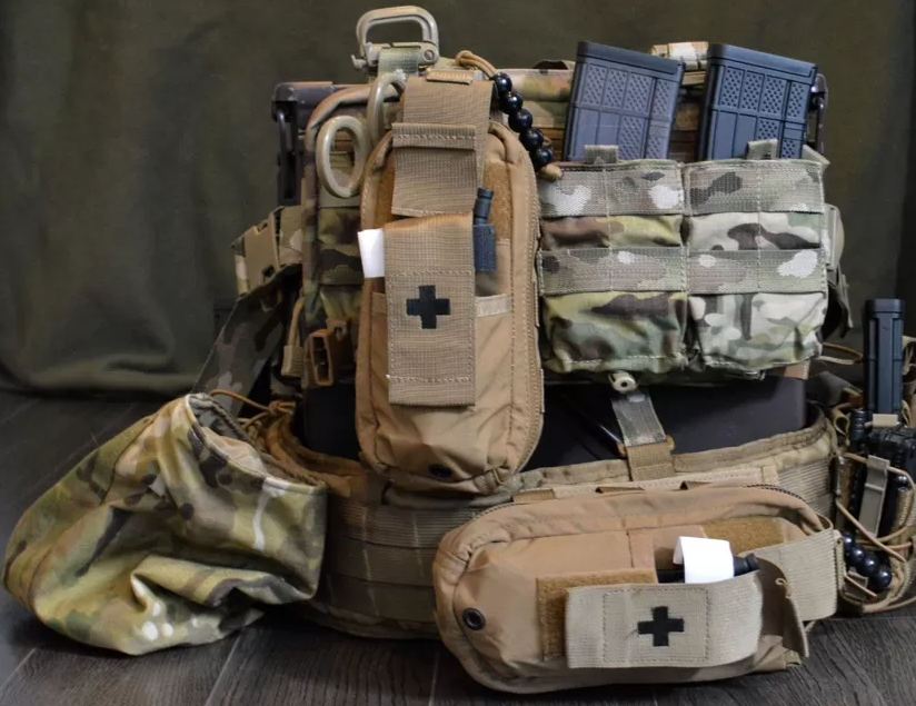 Tactical med kits with military equipment around them