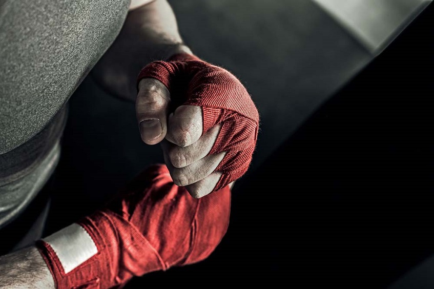 Red hand wraps on boxers hand
