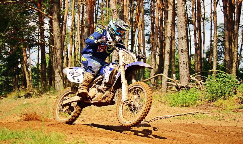 Man riding motocross in nature